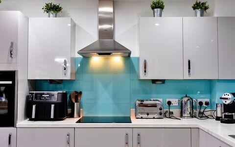 South Beach House: Kitchen Appliance, Kitchen, Countertop, Major Appliance, Interior Design, Cabinetry, Home Appliance, Furniture, Flooring, Kitchen Stove