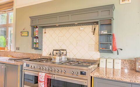 Evergreen Manor: Kitchen, Wood, Major Appliance, Interior Design, Kitchen Appliance, Kitchen Stove, Countertop, Cabinetry, Flooring, Gas Stove