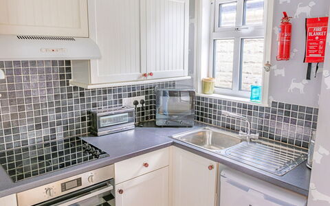 Evergreen Manor: Kitchen, Kitchen Appliance, Countertop, Major Appliance, Interior Design, Sink, Plumbing Fixture, Flooring, Cabinetry, Kitchen Sink