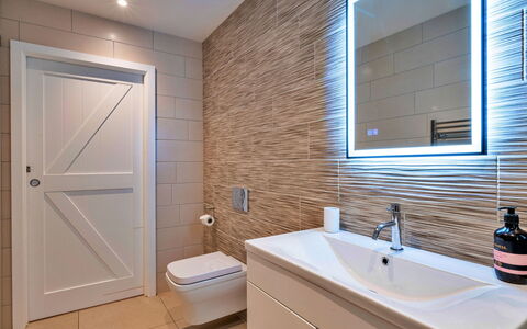 The Asparagus Shed: Interior Design, Flooring, Wall, Plumbing Fixture, Bathroom, Floor, Wood, Bathroom Cabinet, Mirror, Sink