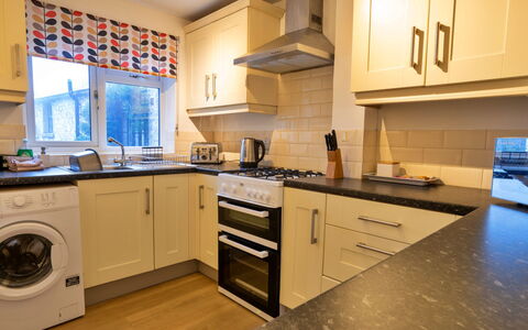 East Bank: Kitchen Appliance, Kitchen, Countertop, Major Appliance, Interior Design, Flooring, Cabinetry, Home Appliance, Wood, Kitchen Stove