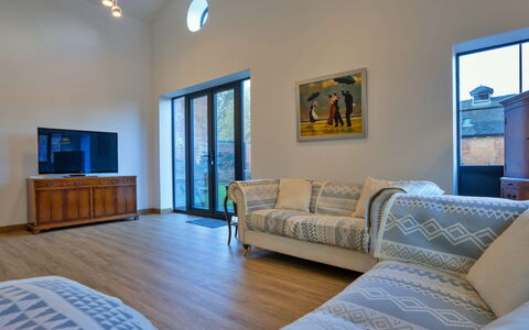 Courtyard View at Longford: Furniture, Interior Design, Couch, Flooring, Floor, Wall, Wood, Room, Ceiling, Living Room