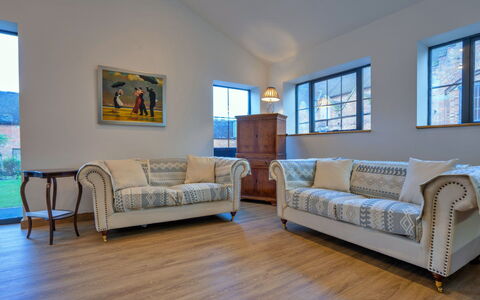 Courtyard View at Longford: Furniture, Couch, Interior Design, Flooring, Wood, Floor, Living Room, Wood Flooring, Room