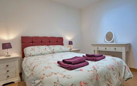 Courtyard View at Longford: Bed, Furniture, Bedding, Bedroom, Bed Sheet, Interior Design, Wood, Linens, Room, Drawer