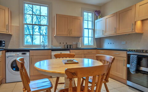 South Lodge at Longford: Furniture, Cabinetry, Flooring, Countertop, Interior Design, Kitchen, Floor, Wood, Kitchen Appliance, Major Appliance