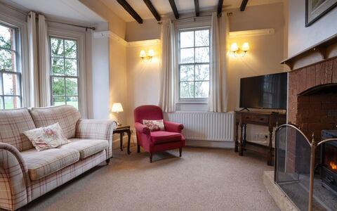South Lodge at Longford: Furniture, Wall, Interior Design, Wood, Flooring, Ceiling, Floor, Room, Lighting, Living Room
