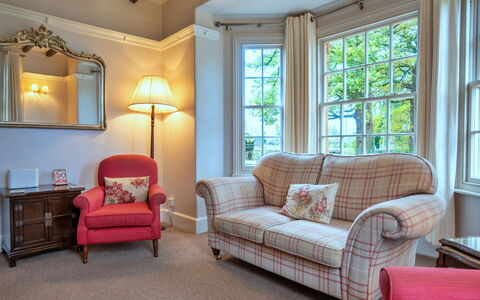 South Lodge at Longford: Furniture, Interior Design, Wood, Couch, Flooring, Floor, Textile, Ceiling, Living Room, Room