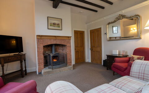 South Lodge at Longford: Wall, Furniture, Home, Flooring, Picture Frame, Room, Living Room, Ceiling, Hearth