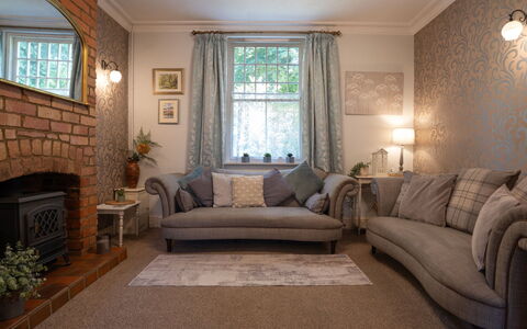 House on the Green: Furniture, Interior Design, Wall, Couch, Flooring, Floor, Living Room, Lighting, Home, Room