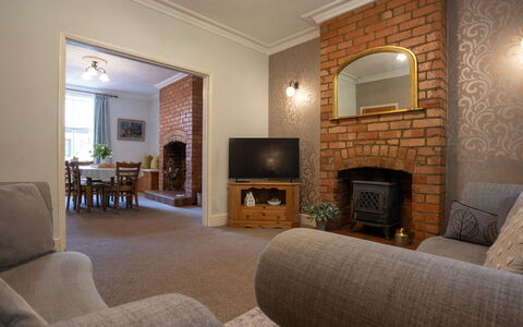 House on the Green: Furniture, Interior Design, Wall, Flooring, Floor, Wood, Ceiling, Hearth, Room, Living Room