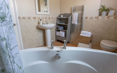 House on the Green: Bathroom, Plumbing Fixture, Interior Design, Flooring, Floor, Bathtub, Tap, Plumbing, Room, Bathroom Sink