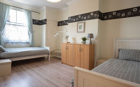 House on the Green: Furniture, Interior Design, Bed, Floor, Flooring, Bedroom, Wall, Wood, Room, Wood Flooring