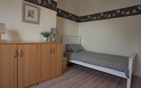 House on the Green: Furniture, Flooring, Floor, Interior Design, Wood, Bedroom, Bed, Room, Drawer, Lighting