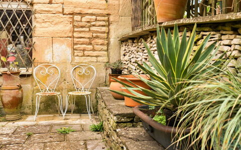 Aarons: Flowerpot, Houseplant, Flagstone, Brick, Garden, Chair, Outdoor Furniture, Stone Wall, Landscaping, Backyard