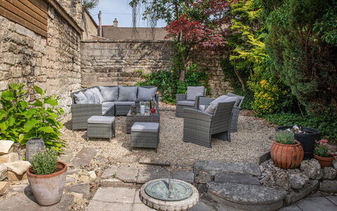 The Painswick Retreat: Furniture, Outdoor Furniture, Flowerpot, Outdoor Table, Chair, Flagstone, Garden, Houseplant, Patio