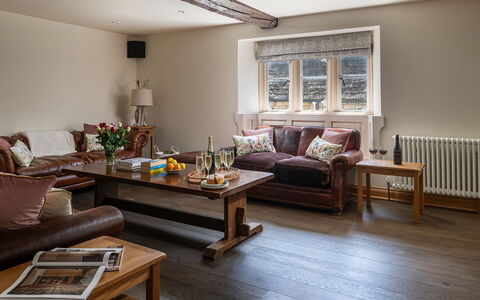 The Painswick Retreat: Furniture, Interior Design, Flooring, Couch, Floor, Wall, Wood, Living Room, Room, Wood Flooring