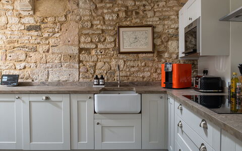 Tranquility House: Kitchen, Countertop, Cabinetry, Furniture, Kitchen Appliance, Interior Design, Wall, Flooring, Wood, Major Appliance