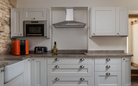 Tranquility House: Cabinetry, Wood, Kitchen, Countertop, Flooring, Interior Design, Furniture, Major Appliance, Kitchen Appliance, Drawer