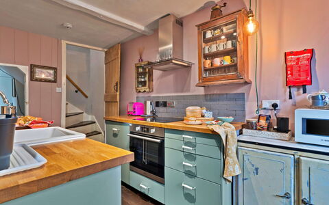 Flittermouse Cottage: Kitchen, Kitchen Appliance, Countertop, Furniture, Major Appliance, Interior Design, Cabinetry, Wood, Flooring, Room