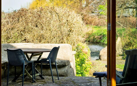Mill Barn by the Stream: Green, Furniture, Leaf, Chair, Table, Outdoor Furniture, Outdoor Table, Sunlight, Garden, Twig