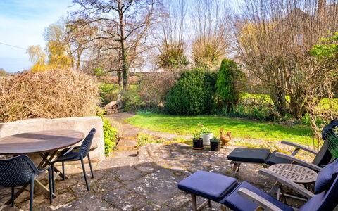 Mill Barn by the Stream: Furniture, Outdoor Furniture, Shrub, Garden, Chair, Groundcover, Outdoor Table, Sunlight, Shade, Landscaping