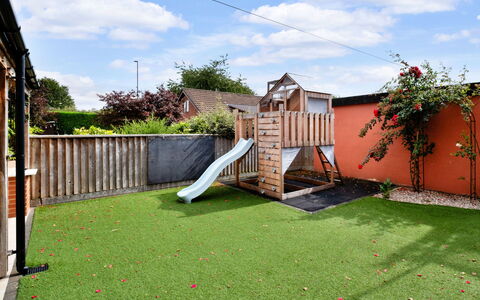 Elizabeth House: Grass, Garden, Backyard, Lawn, Yard, Landscaping, Playground Slide, Artificial Turf, Outdoor Play Equipment, Courtyard