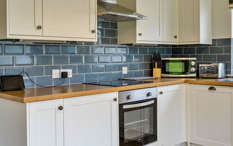 Trecane: Countertop, Kitchen, Cabinetry, Kitchen Appliance, Flooring, Interior Design, Major Appliance, Floor, Drawer, Tap