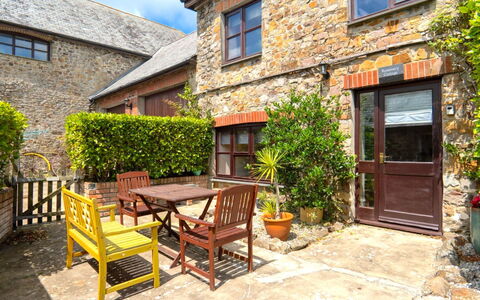 Rosemary Cottage at Widemouth Bay: Shrub, Cottage, Door, Flowerpot, Houseplant, Garden, Brick, Yard, Landscaping, Farmhouse