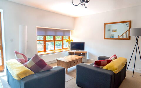Rosemary Cottage at Widemouth Bay: Furniture, Interior Design, Wall, Flooring, Couch, Wood, Room, Ceiling, Floor, Living Room