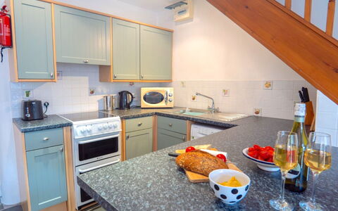 Rosemary Cottage at Widemouth Bay: Kitchen, Countertop, Kitchen Appliance, Major Appliance, Kitchen Sink, Cabinetry, Interior Design, Flooring, Furniture, Sink