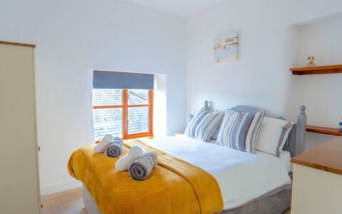Rosemary Cottage at Widemouth Bay: Wall, Interior Design, Furniture, Wood, Floor, Bed, Bedroom, Flooring, Bed Sheet, Home