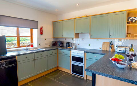 Olive Tree at Widemouth Bay: Kitchen, Kitchen Appliance, Countertop, Cabinetry, Major Appliance, Interior Design, Flooring, Wood, Home Appliance, Kitchen Stove