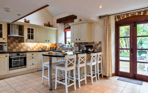 Goose, Quinceborough Farm: Furniture, Interior Design, Kitchen, Flooring, Countertop, Cabinetry, Wood, Light Fixture, Floor, Chair