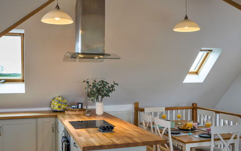 Tregirls: Furniture, Interior Design, Flooring, Wood, Ceiling, Floor, Light Fixture, Kitchen, Countertop, Room