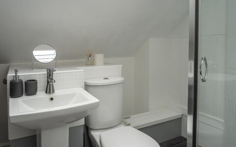 Three Gables: Bathroom, Bathroom Sink, Plumbing Fixture, Sink, Toilet Seat, Wall, Toilet, Flooring, Interior Design, Floor