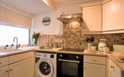 St. Ives 636: Kitchen Appliance, Countertop, Kitchen, Major Appliance, Interior Design, Washing Machine, Cabinetry, Flooring, Home Appliance, Laundry Room