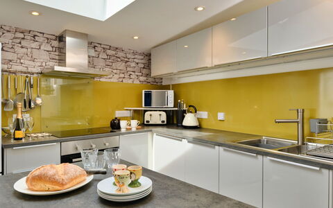 Agan Chi: Kitchen, Kitchen Appliance, Countertop, Major Appliance, Interior Design, Yellow, Flooring, Ceiling, Furniture, Cabinetry