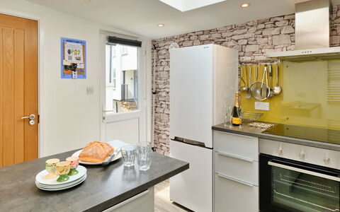 Agan Chi: Countertop, Kitchen, Furniture, Kitchen Appliance, Interior Design, Cabinetry, Major Appliance, Flooring, Wall, Wood