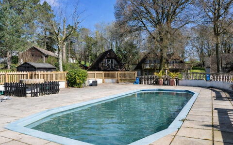 Toblerone Lodge: Swimming Pool, Resort, Cottage, Shade, Estate, Fence, Eco Hotel, Resort Town, Backyard, Outdoor Structure