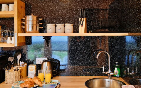 Demelza Shepherd'S Hut: Kitchen, Countertop, Granite, Kitchen Appliance, Plumbing Fixture, Natural Material, Tap, Plumbing, Cabinetry, Wood Stain