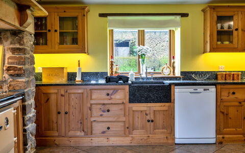Oak Leaf Cottage: Kitchen, Countertop, Cabinetry, Interior Design, Furniture, Flooring, Kitchen Appliance, Wood, Major Appliance, Cupboard