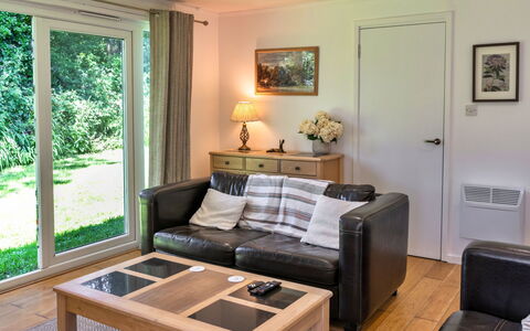 Brockwood: Furniture, Interior Design, Couch, Flooring, Wood, Floor, Room, Living Room, Table, Lighting