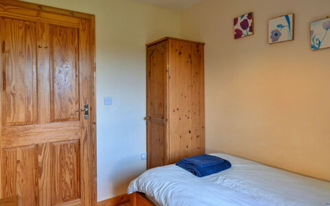 Tarka'S Holt Log Cabin, Stowford: Furniture, Wood, Flooring, Bedroom, Interior Design, Floor, Bed, Room, Bed Sheet, Wood Stain