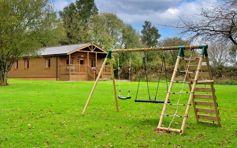 Tarka'S Holt Log Cabin, Stowford: Wood, Outdoor Play Equipment, Shade, Garden, Lawn, Swing, Playground, Park, Yard, Wood Stain