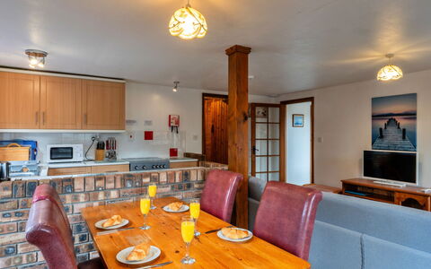 Tarquol Cottage, Stowford: Furniture, Interior Design, Wood, Flooring, Ceiling, Floor, Room, Table, Couch, Living Room