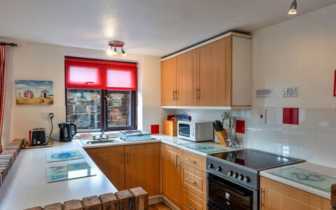 Tarquol Cottage, Stowford: Kitchen, Kitchen Appliance, Countertop, Major Appliance, Furniture, Kitchen Stove, Cabinetry, Interior Design, Stove, Flooring