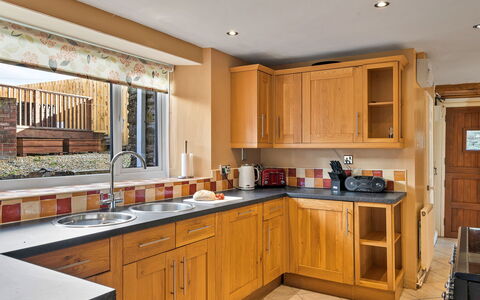 The Old School House at Instow: Kitchen, Furniture, Countertop, Cabinetry, Interior Design, Kitchen Appliance, Flooring, Wood, Major Appliance, Sink