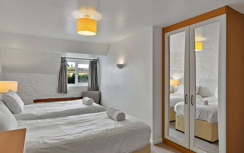 The Old School House at Instow: Bed, Wall, Interior Design, Bedroom, Bedding, Wood, Bed Sheet, Ceiling, Furniture, Floor