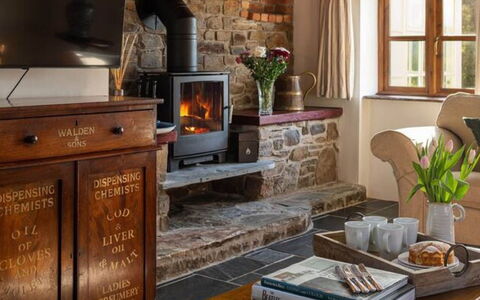 Coulscott Farmhouse: Furniture, Wall, Interior Design, Wood, Flooring, Hearth, Lighting, Room, Floor, Living Room
