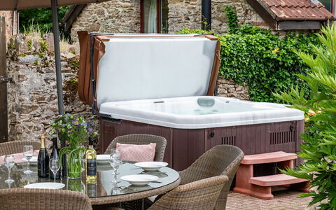 Coulscott House: Bathtub, Plumbing Fixture, Flowerpot, Houseplant, Garden, Jacuzzi, Yard, Backyard, Patio